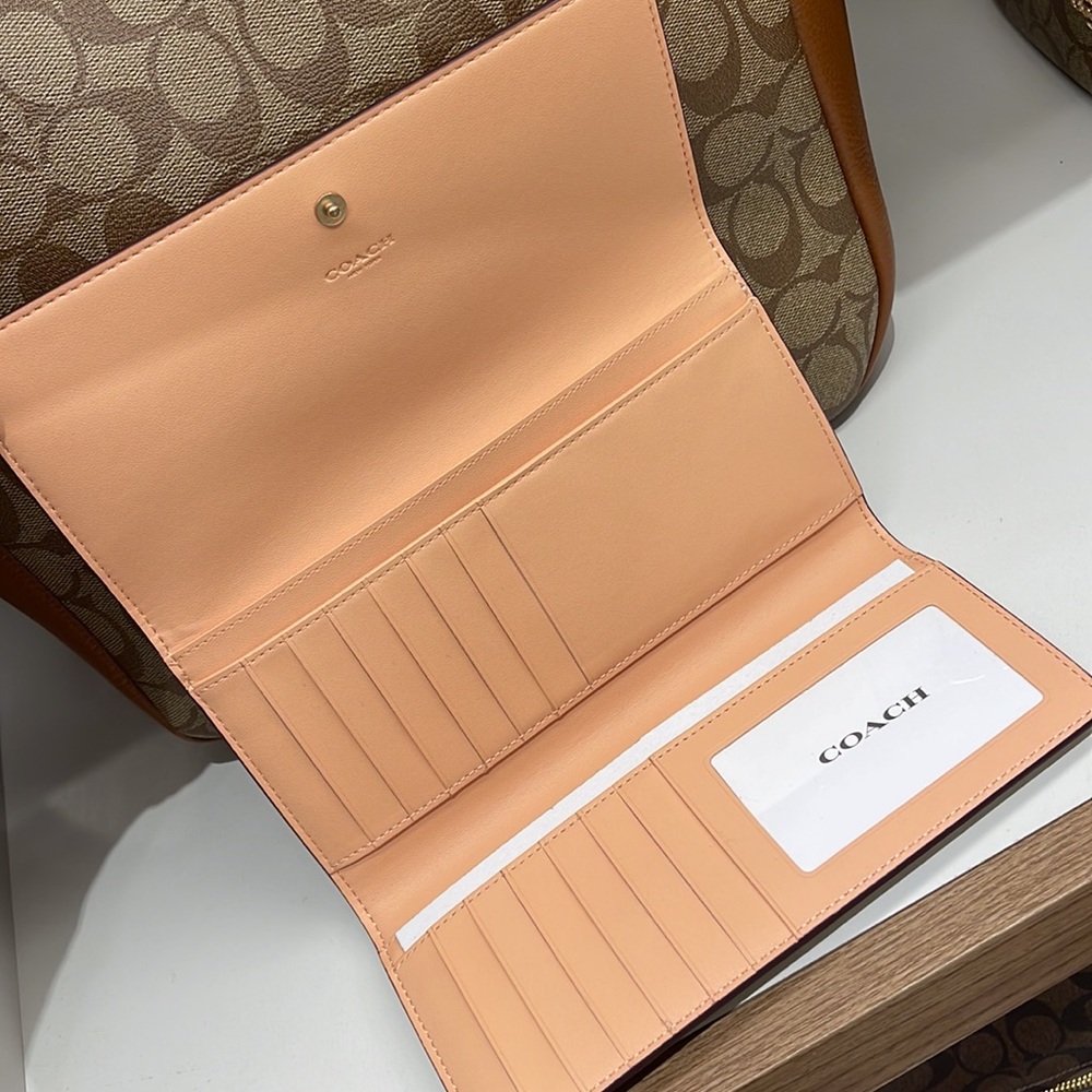Coach Slim Trifold Wallet In Signature Canvas
IM/Light Khaki/Faded Blush - Picture 8 of 16